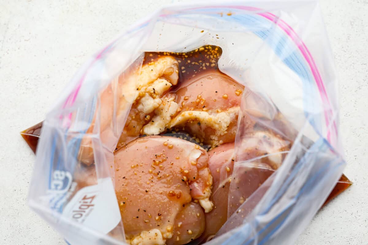 One bite of this grilled bourbon chicken and your tastebuds will be dancing with delight! It's marinated in a flavorful homemade bourbon sauce that tastes amazing. You will be making it on the regular once you see what a huge hit it is! Chicken thighs in a plastic ziplock bag.