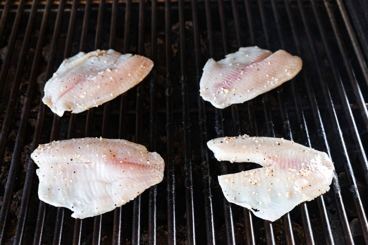 Fire up the grill! This grilled tilapia is deliciously seasoned and has the best flaky texture. Tilapia on a grill.