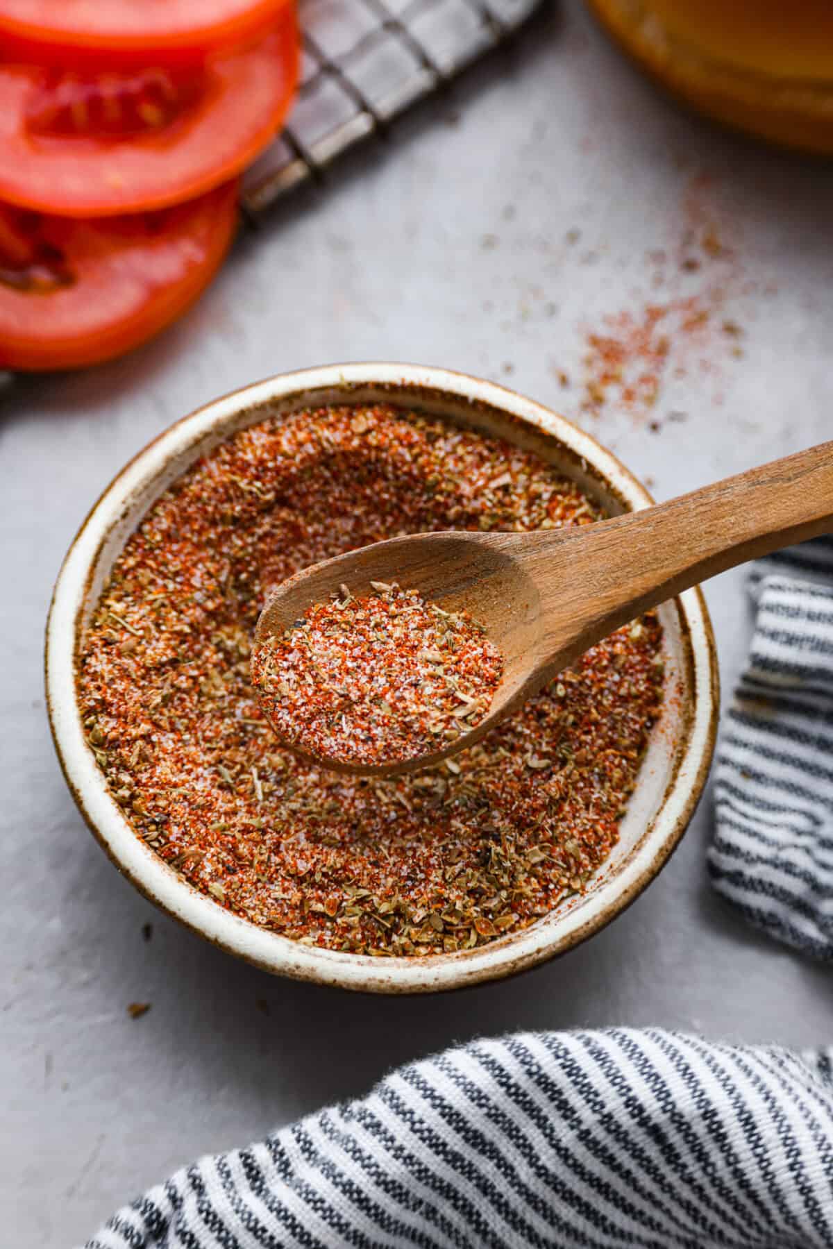 This flavorful Burger Seasoning will take your favorite burger recipe to a new level of delicious! It’s a simple, yet tasty blend of staple spices and seasonings that makes each bite better than the next! Closeup of burger seasoning in a bowl.