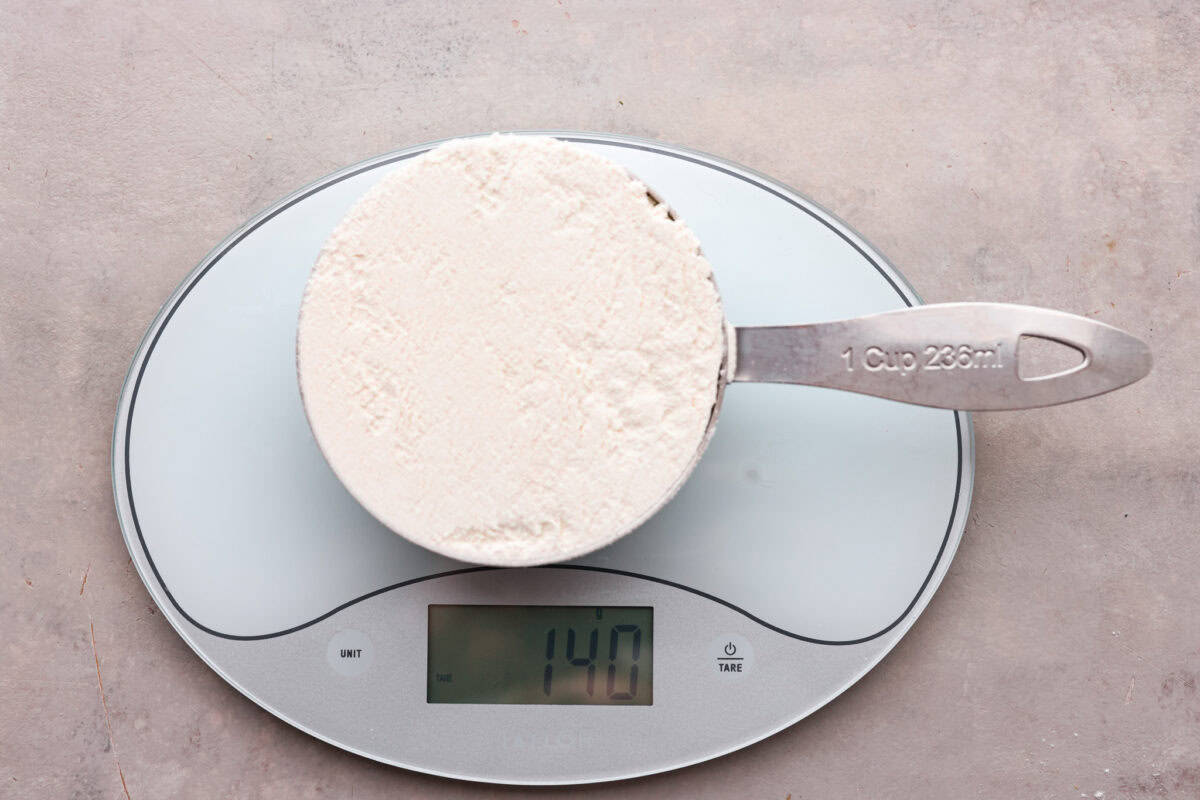 Whether you are a seasoned baker or just starting out, this informational post has all of my tips and tricks on how to properly measure baking ingredients. Flour scooped incorrectly showing why it's important to properly measure baking ingredients.