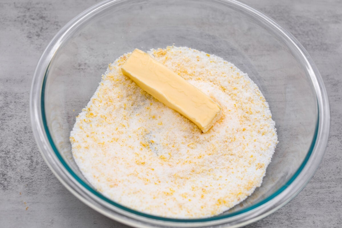 Lemon crinkle cookies are thick, soft pillows of lemon deliciousness! They have a refreshing flavor with an irresistible chewy texture. The perfect balance of sweet and tart make these a welcome treat for any occasion! The sugar, butter, and lemon zest being combined.