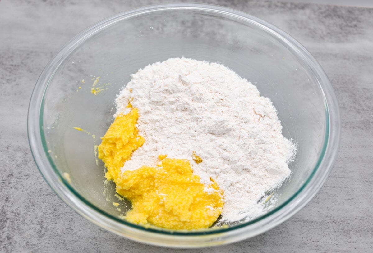 Lemon crinkle cookies are thick, soft pillows of lemon deliciousness! They have a refreshing flavor with an irresistible chewy texture. The perfect balance of sweet and tart make these a welcome treat for any occasion! Mixing the batter together for the lemon crinkle cookies