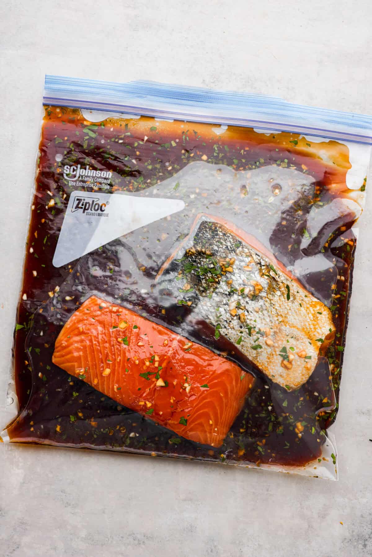A good salmon marinade is the best way to achieve a seafood meal that's incredibly flavorful with tender, juicy fish! Salmon filets in a ziplock bag with marinade.