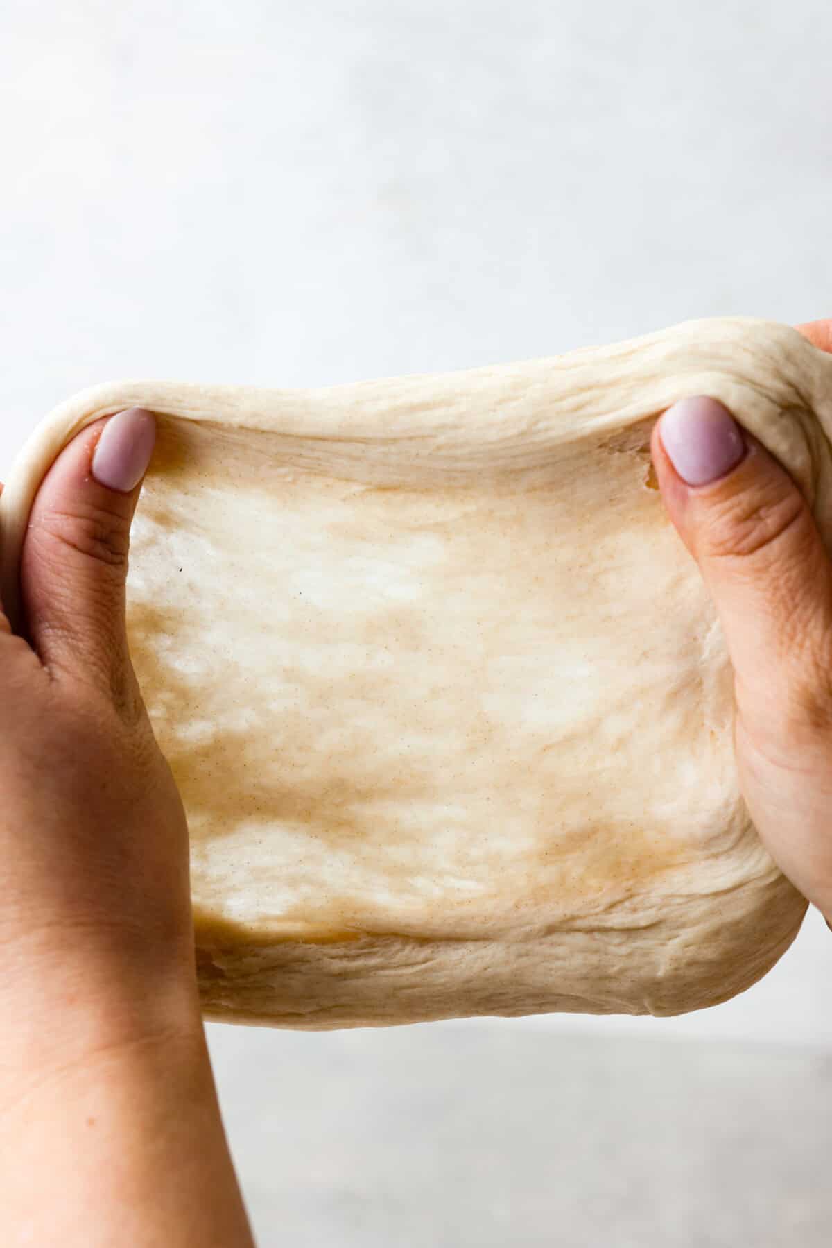 You asked for help with yeast, so I have created a "How to Bake with Yeast" guide just for you! Yeast doesn't have to be intimidating, and I hope that by the end of this post, you will be an expert! Gluten window test picture of strong dough.