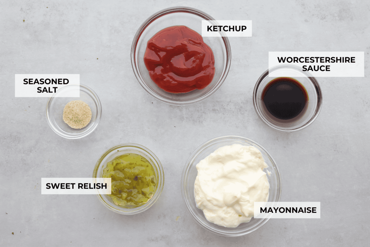 This burger sauce is a game-changer for your cookouts, adding a delicious twist to your favorite meals. Whip it up in minutes and enjoy a flavorful blend thatโs perfect for burgers or as a dip for fries. A top view of the ingredients in individual glass bowls and each labeled.