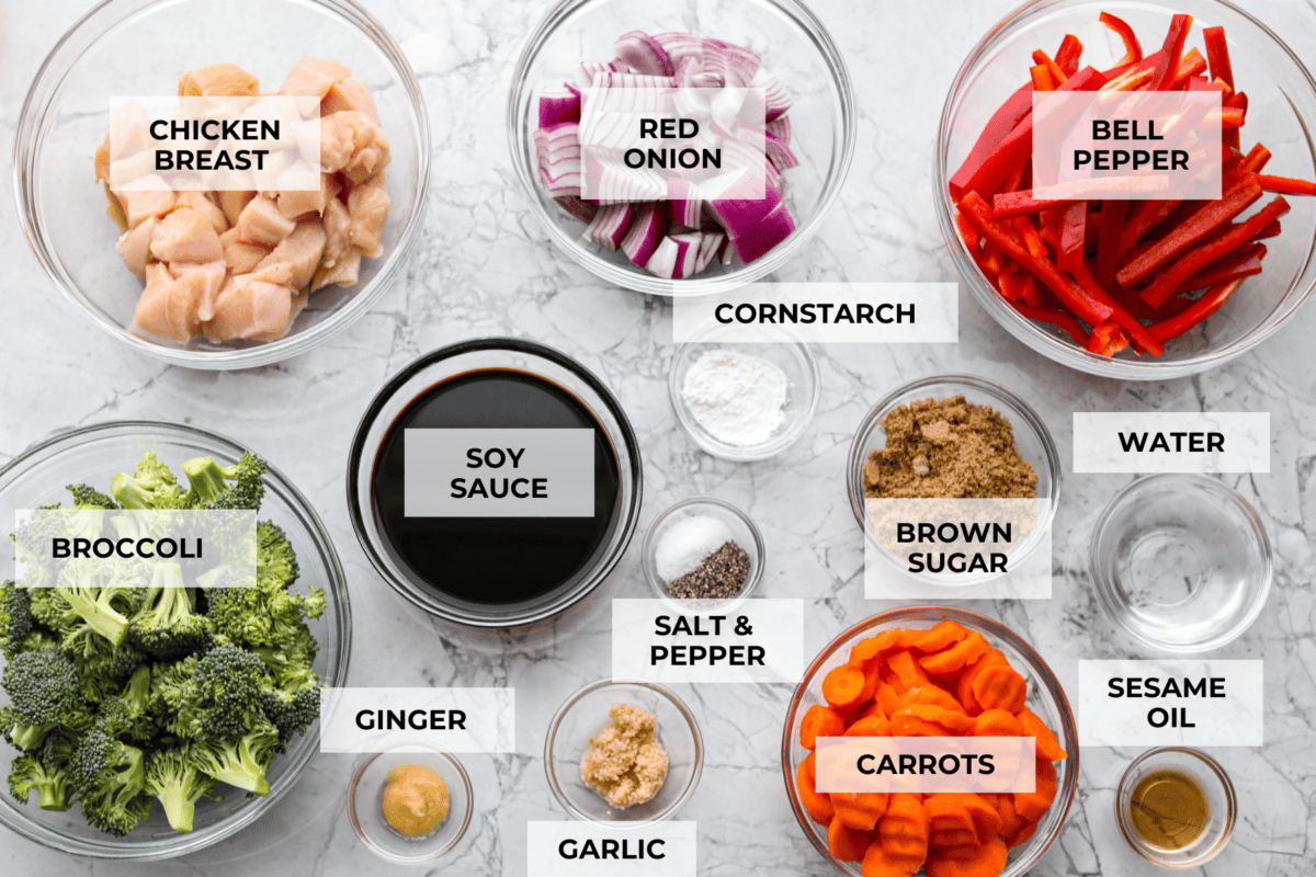 This sheet pan teriyaki chicken with vegetables is a family favorite! It's loaded with tender chicken and veggies that get tossed in a homemade teriyaki sauce. A one pan dinner recipe that is super easy to throw together. Ingredients labeled to make sheet pan chicken teriyaki with vegetables.
