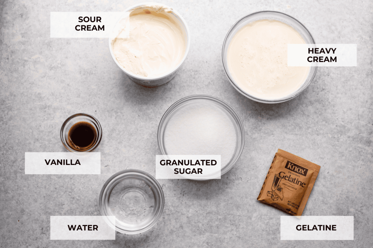 Treat yourself to this luxurious and refreshing Swedish Cream, a classic dessert that's easy to make. With a few simple ingredients and some chill time, you'll have a delightful treat topped with fresh berries and mint. Overhead shot of individual ingredients with labels.