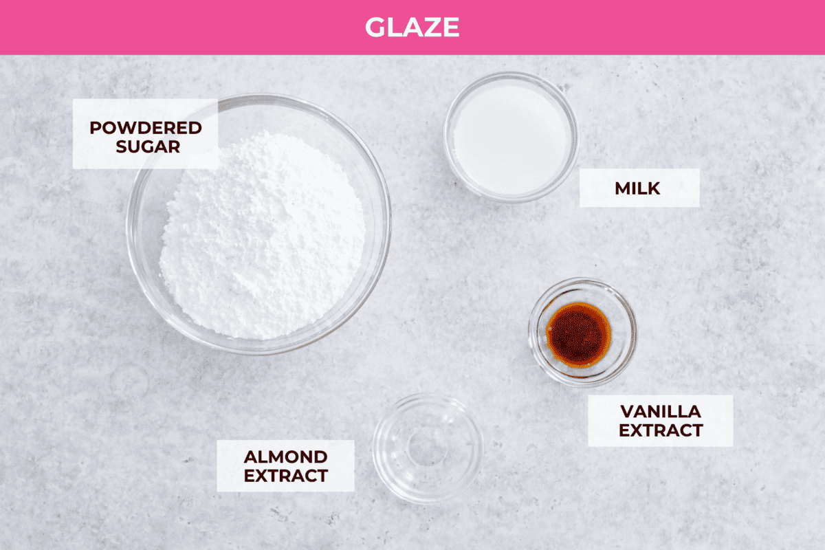 Enjoy cherry pie in its best form: cherry pie bars! You can whip up a whole pan in minutes using cherry pie filling. They’re beautiful, easy to make, and always a crowd-pleaser! The top view of all of the glaze ingredients for the cherry pie bars, all labeled.
