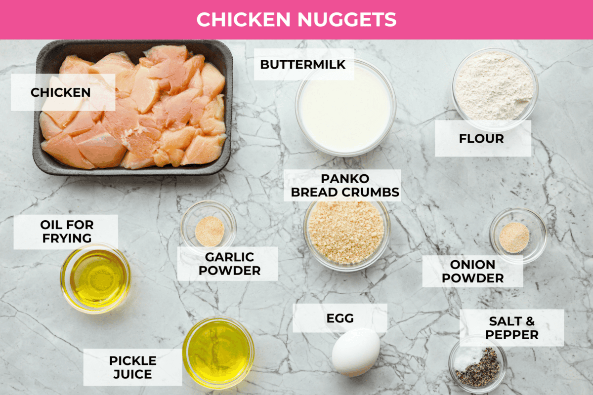 These Chick-fil-A Nuggets taste just like the real thing! They are crispy and salty with the slightest hint of sweetness.ย Pair them with the Chick-fil-A sauce and make the perfect family meal! A top view shot of ingredients, all in individual bowls and labeled.