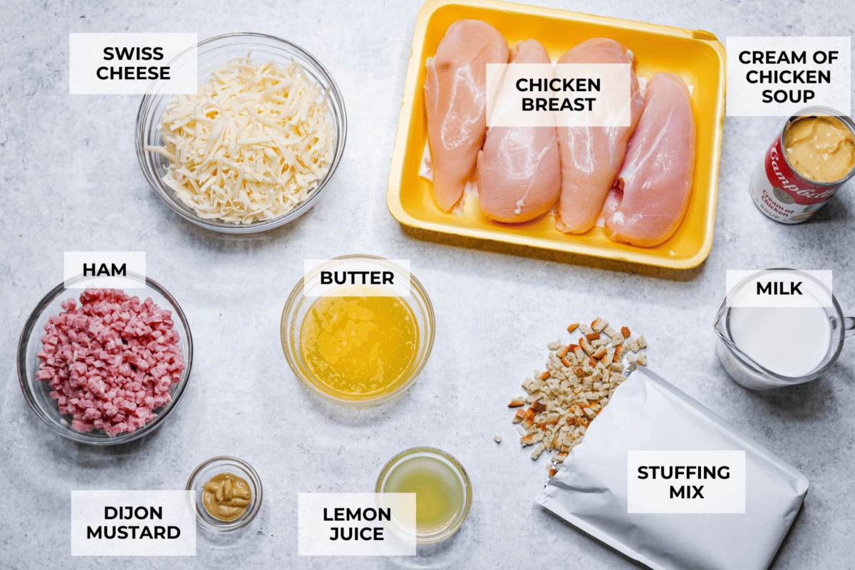 Treat yourself to this easy, Slow Cooker Chicken Cordon Bleu recipe! With tender chicken, savory ham, and melty Swiss cheese, it's a perfect comfort meal for any day. The top view of ingredients al individually laid out on the counter and labeled.