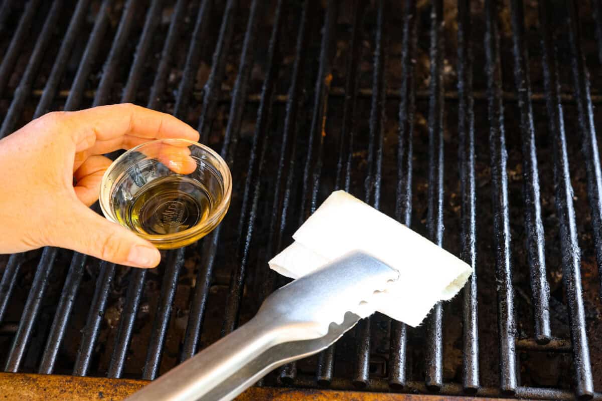 Fire up your grill because these grilling basics will give you all the confidence you need! Discover how easy it is to cook, entertain, and make incredible food on an outdoor grill. Second photo of oiling the grill.