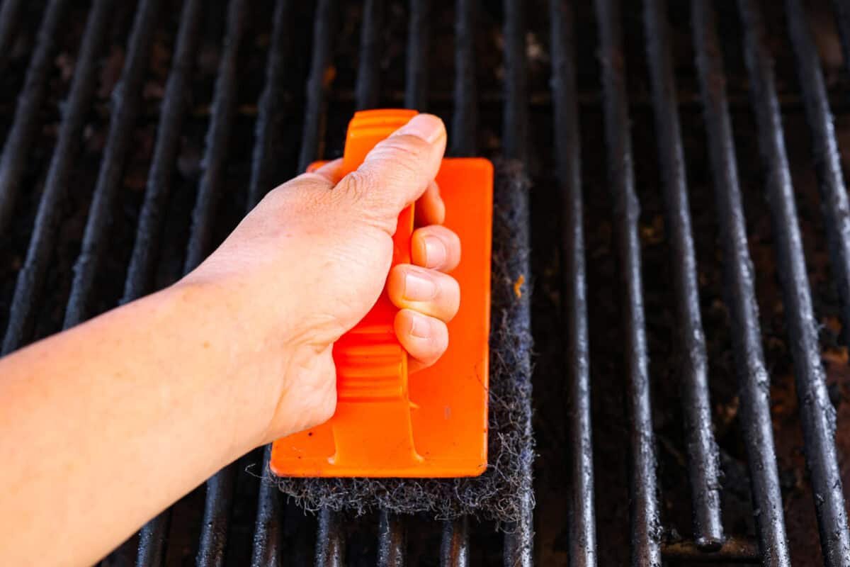 Fire up your grill because these grilling basics will give you all the confidence you need! Discover how easy it is to cook, entertain, and make incredible food on an outdoor grill. First photo of cleaning the grill.