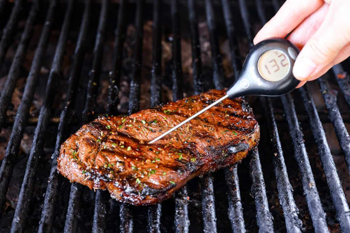 Fire up your grill because these grilling basics will give you all the confidence you need! Discover how easy it is to cook, entertain, and make incredible food on an outdoor grill. Second photo of taking the temperature of a steak.