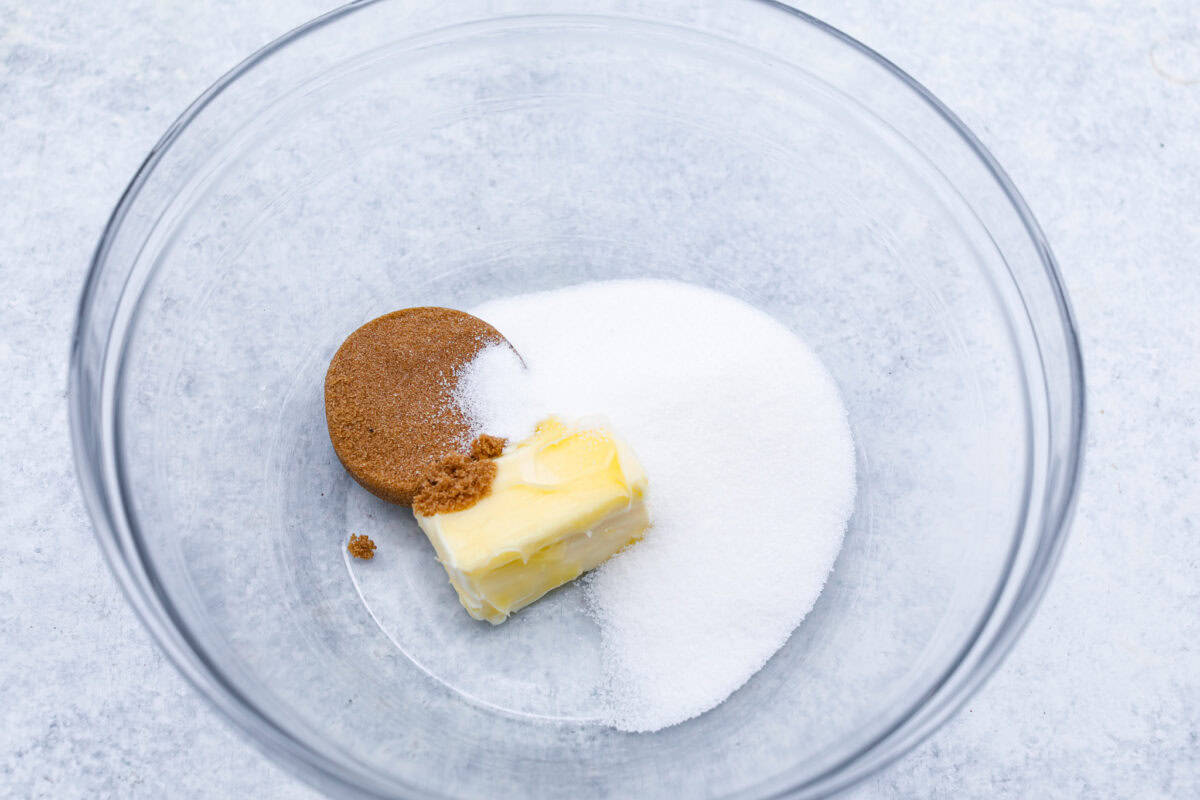 Perfect Pineapple Upside-Down Cake is a moist and fruity pineapple cake topped with caramelized pineapple rings and sweet maraschino cherries. It's no wonder this classic dessert has been a tried and true favorite for years! First photo of the sugars and butter mixing.