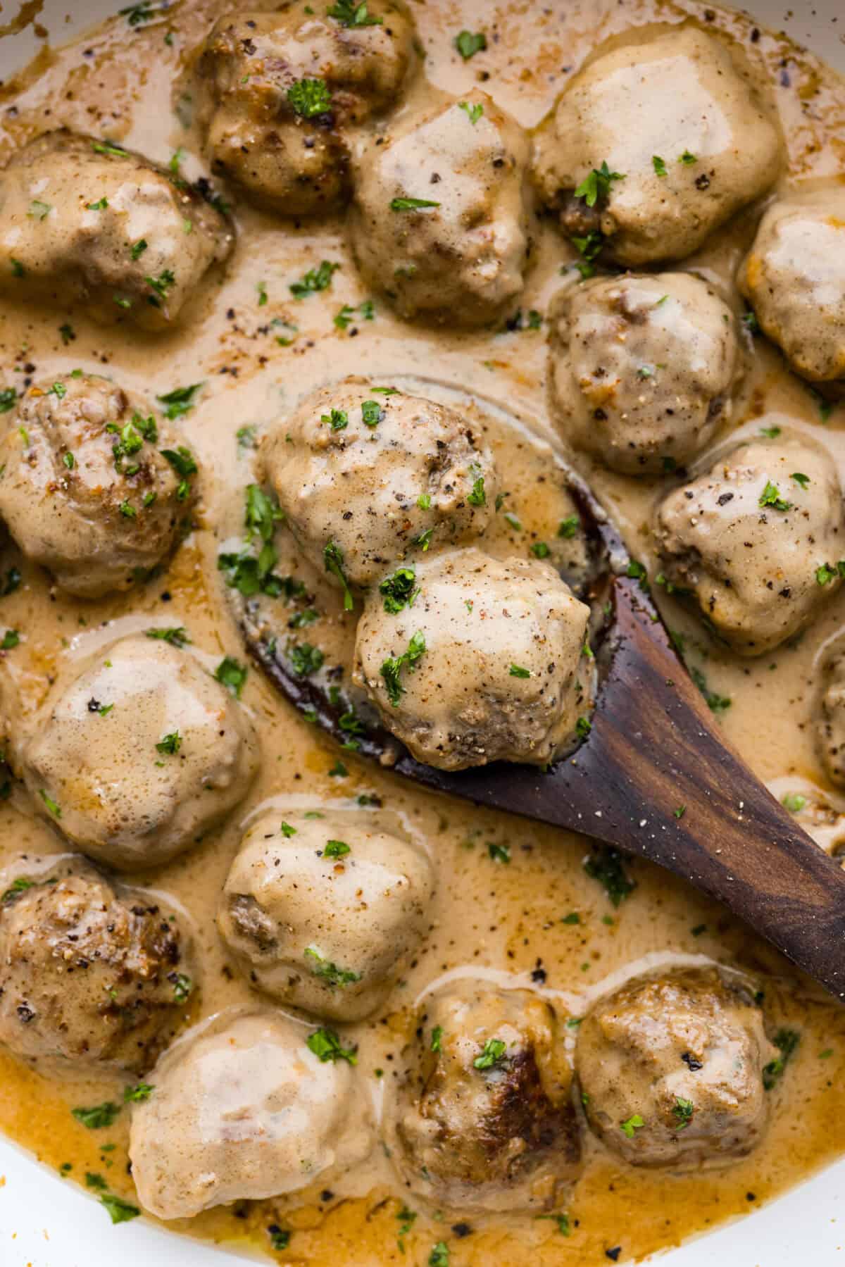 From frozen to from-scratch, this is your one-stop shop for all things Swedish Meatballs! A close up of Swedish meatballs in sauce.