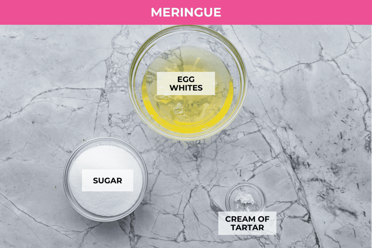 Impress everyone with this gorgeous Baked Alaska dessert! It's surprisingly easy to make with just 5 ingredients. Layers of cake, ice cream and meringue will have your friends and family begging for a slice! Overhead shot of labeled meringue ingredients.