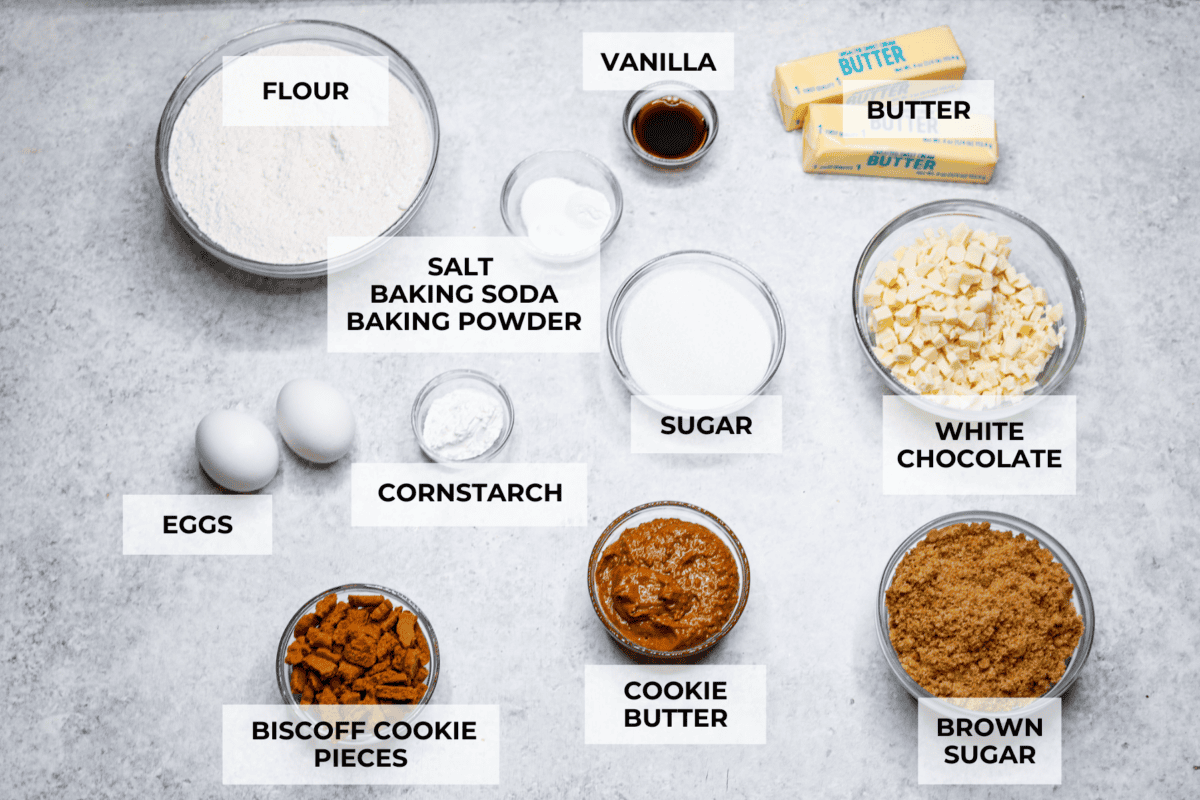 Satisfy your sweet tooth with loaded Biscoff Cookies. They are soft and chewy and infused with the flavor of Biscoff cookies and cookie butter. These are easy to whip up and will be a hit for any occasion! Overhead shot of labeled ingredients.