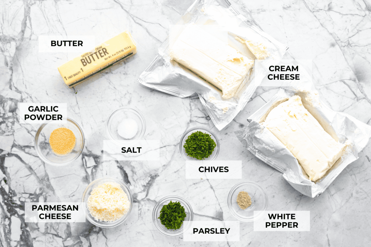 Boursin cheese is soft, creamy, and bursting with herbal flavor. Its texture is similar to cream cheese, making it incredibly versatile. It shines as a dip, enhances pasta dishes, complements meats, enriches sauces and soups, and so much more! Overhead shot of labeled ingredients.