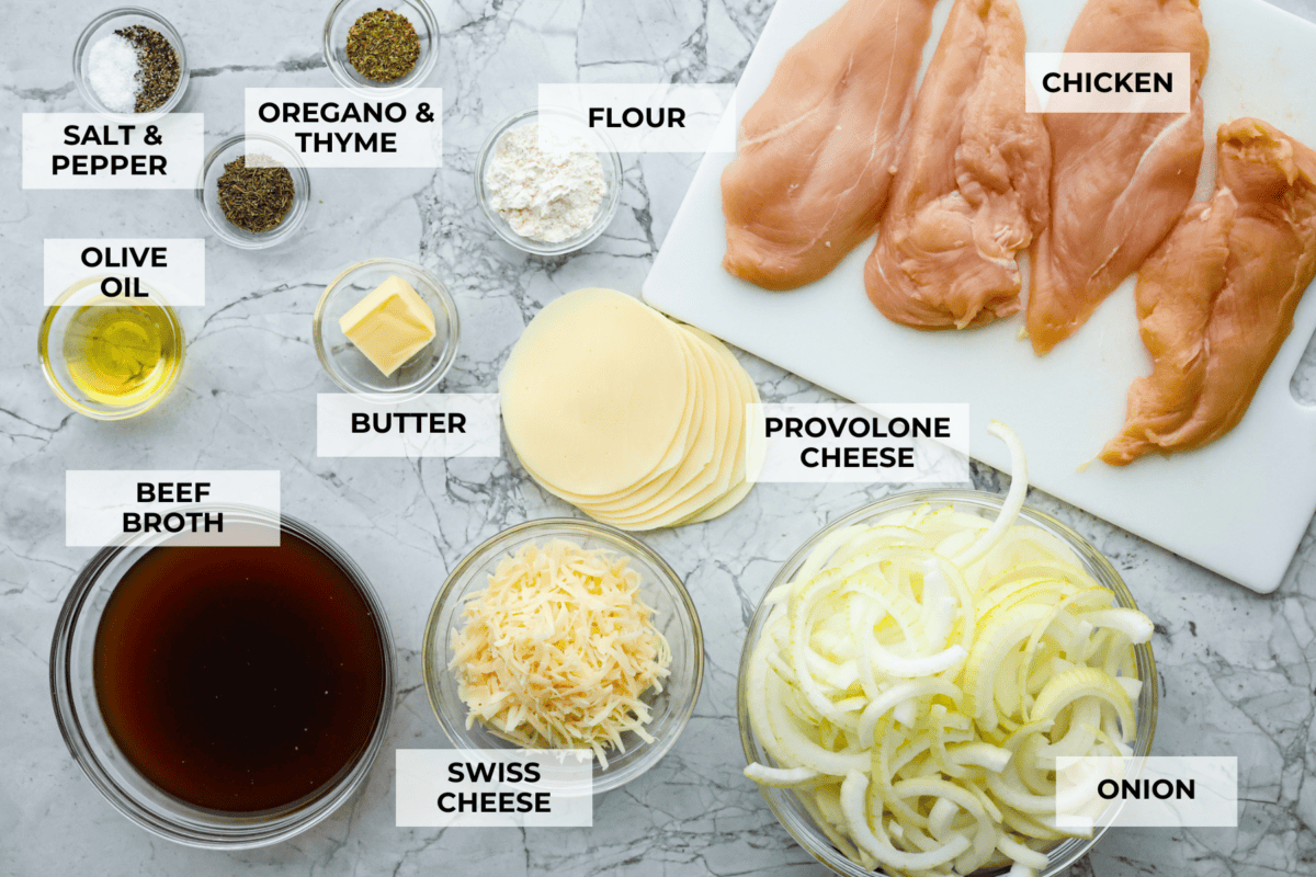 Skillet French Onion Chicken delivers a tender and creamy chicken dinner that you can make at home, it's easily better than anything you can find in a restaurant. Your family will love this incredibly delicious meal, making it an instant favorite! Overhead shot labeled ingredients to make French onion chicken.