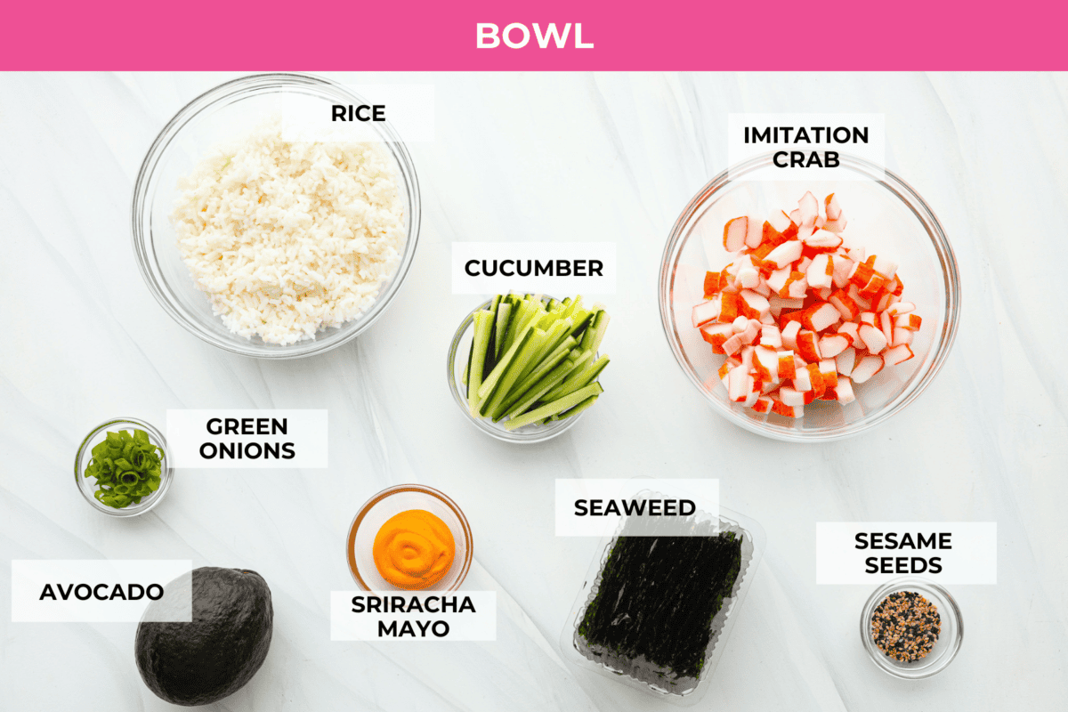 This sushi bowl is a deconstructed California sushi roll loaded with irresistible flavor and all of the best sushi ingredients. Itโs layered with sushi rice, crab, cucumber, avocado, a tasty sauce, and more. Itโs easy to make and ready to serve in just 20 minutes! Overhead shot of labeled ingredients.