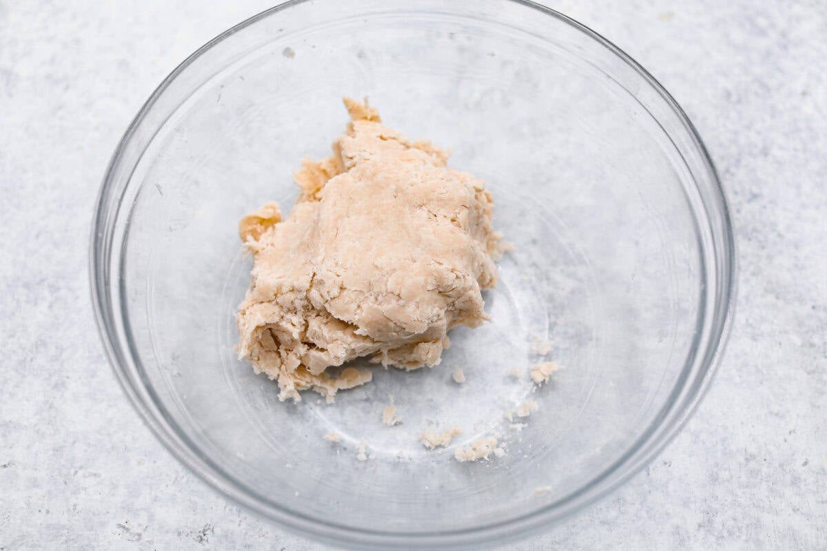 Sugar cream pie, or Hoosier pie, is a creamy, delicious treat with deep roots in the Midwest, especially in Indiana. You can top it however you like, serve it warm, at room temperature, or even chilled. Give this simple recipe a go. I know youโll love it! Overhead shot of crust dough in a ball in a bowl.