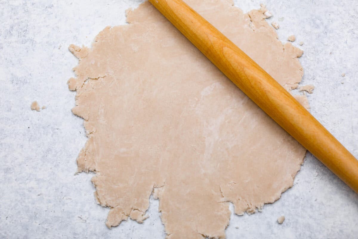 Sugar cream pie, or Hoosier pie, is a creamy, delicious treat with deep roots in the Midwest, especially in Indiana. You can top it however you like, serve it warm, at room temperature, or even chilled. Give this simple recipe a go. I know youโll love it! Overhead shot of pie crust being rolled out on floured surface, with rolling pin.