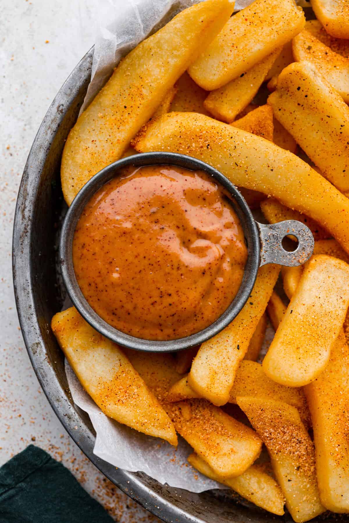 Red Robin campfire sauce is the best pairing for your burgers, fries, and more. Whip it up in minutes with just 4 ingredients and enjoy the deliciously creamy consistency and smoky flavor. Overhead shot of seasoned french fries with a small bowl of red robin campfire sauce.