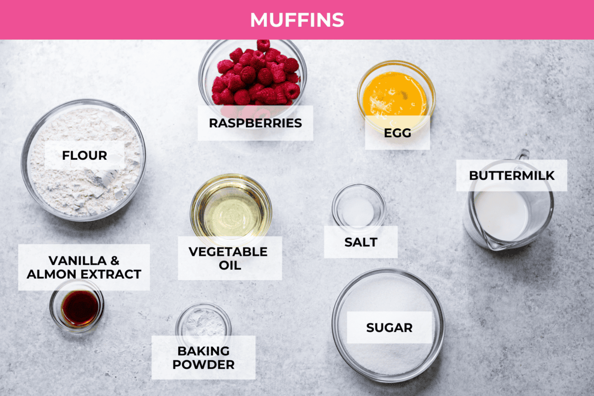 These raspberry muffins are moist and delicious, filled with plump fresh raspberries and topped with a sweet, crunchy streusel topping! They are perfect for a warm breakfast, brunch, or as an after-school or work snack. Your family will be begging for more, so donโt expect them to last long! Overhead shot of labeled muffin ingredients.