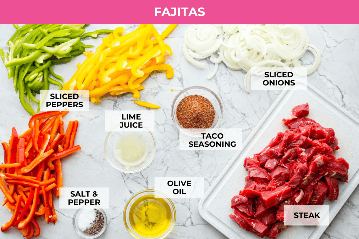 Sheet pan steak fajitas are beautiful and bursting with flavor. Easy to throw together on busy weeknights, they feature tender steak and crisp, colorful vegetables in every bite. You will definitely want to add this to your weekly meal planning! Overhead shot of labeled fajita ingredients.