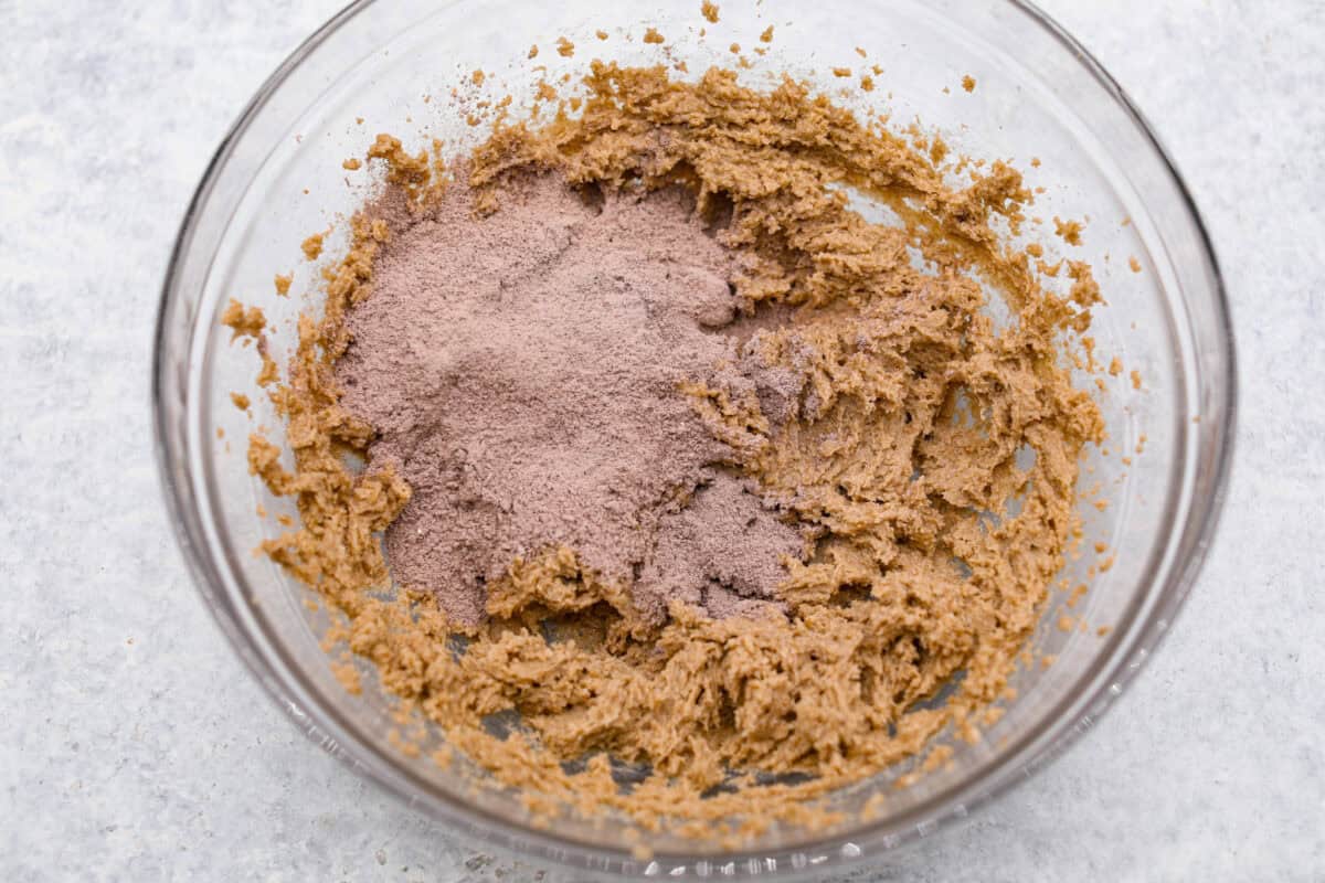 Chocolate Pudding Cookies are soft, chewy, and irresistibly delicious! They are quick and easy to bake and will be a huge hit with anyone who tries them! A bowl of cookie batter with chocolate pudding.