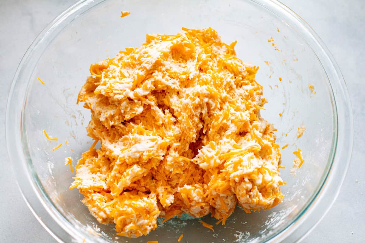 These delicious Copycat Red Lobster Cheddar Bay Biscuits are better than the real thing! Warm, buttery, and ready in 20 minutes! Second photo of the dough formed in a bowl.