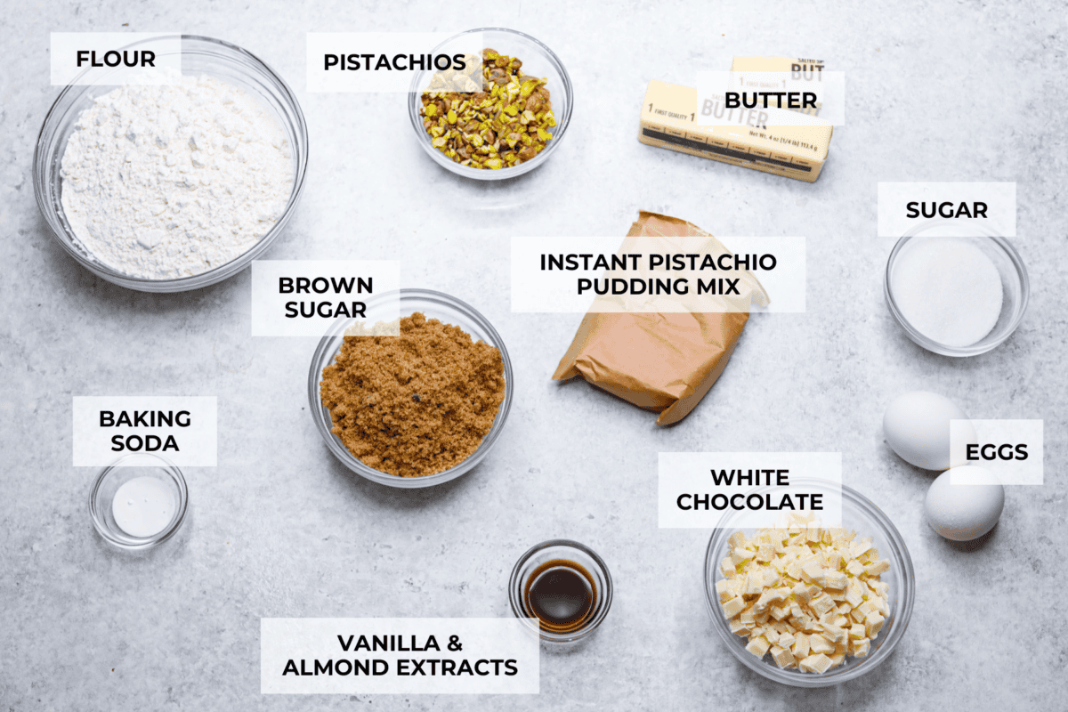 Pistachio Pudding Cookies are super soft, chewy, and irresistible! They're easy to make, and adding pistachio pudding mix gives this cookie recipe wonderful flavor and the perfect tender texture! Overhead shot of labeled ingredients.