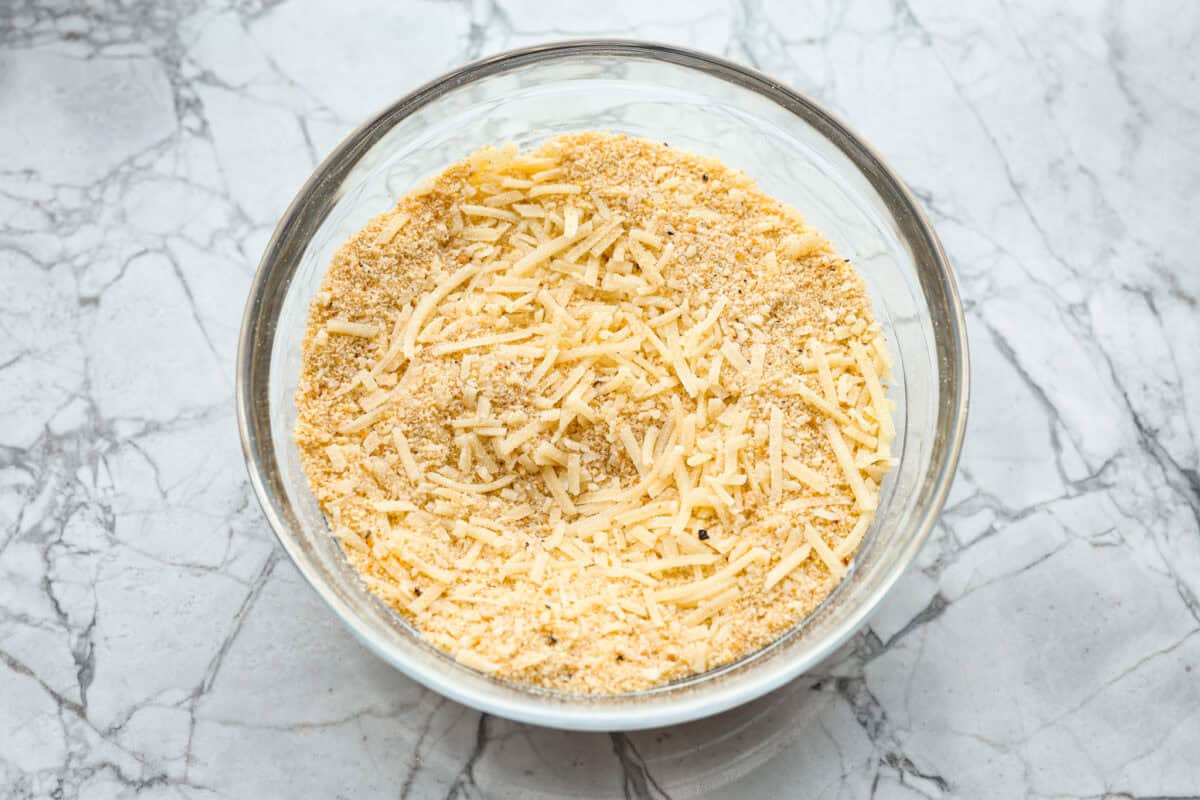 This delicious Louisiana Casserole has become an instant favorite in our house! It has all of the delicious flavors of a jambalaya in an easy-to-make casserole. Tasty andouille sausage, shrimp, veggies, rice and cajun seasoning come together for a complete meal on the table in just 40 minutes! Overhead shot of crumb topping ingredients mixed in a bowl.