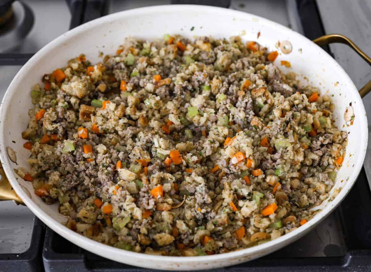Make Turkey Roulade your new Thanksgiving tradition! Boneless turkey breast gets flattened and rolled with sausage stuffing inside. The turkey turns out incredibly moist and is infused with your favorite Thanksgiving flavors. It takes far less time than traditional turkey and will make Thanksgiving day easy and delicious! Fourth photo of the stuffing in a pan.