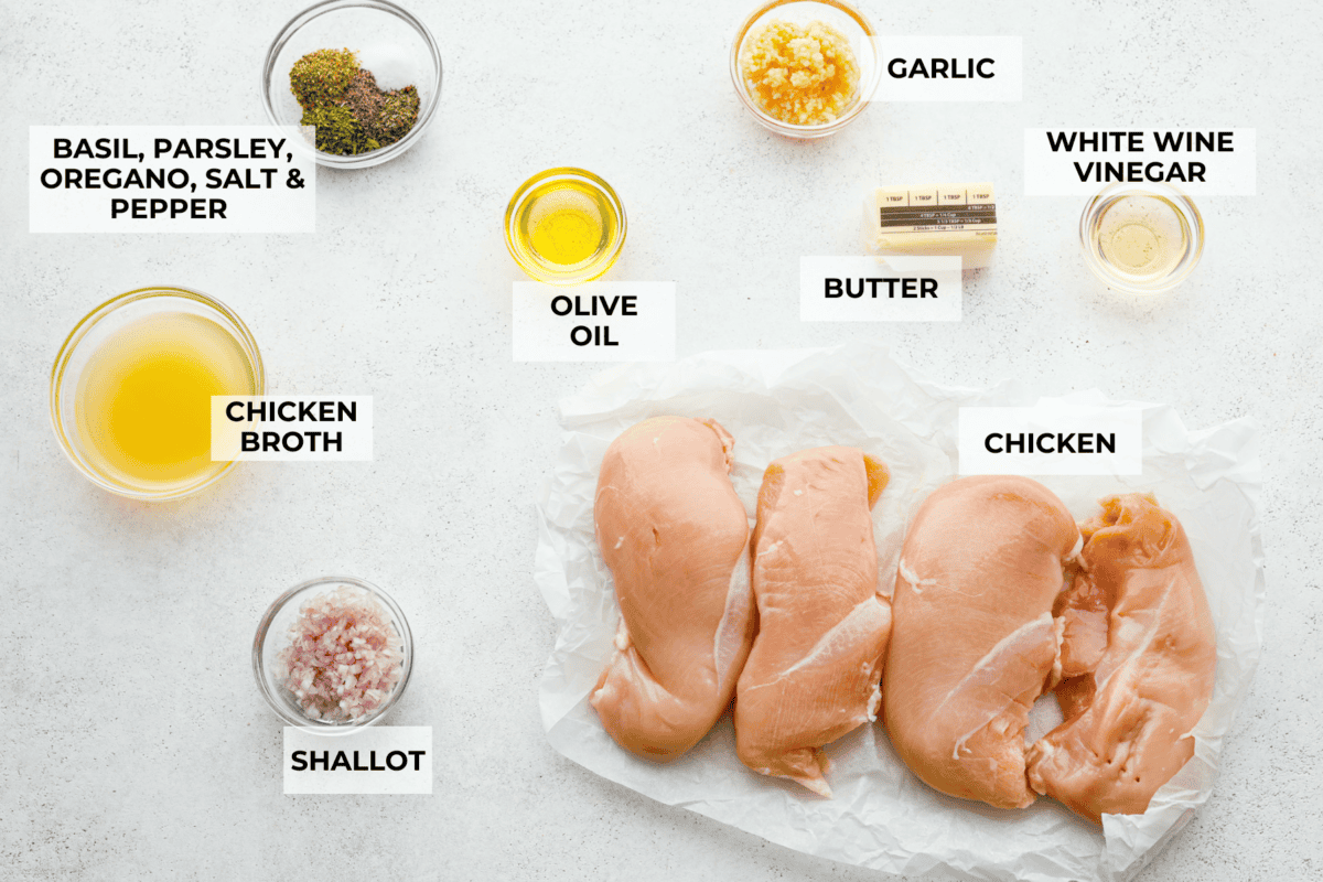 Garlic Butter Chicken is a rich and flavorful one-pan recipe that's on the dinner table in just 30 minutes! Well-seasoned, tender chicken breasts are pan-seared and then nestled in a simple yet tasty sauceย made with vinegar, broth, butter, shallots, and plenty of garlic. Overhead shot of labeled ingredients.
