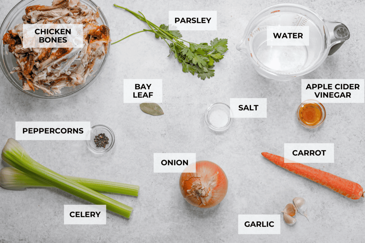 Learn how to make homemade bone broth with all of my top tips and tricks! This easy recipe is a simple combination of wholesome, nutritious ingredients. It's freezer-friendly and great for using in a variety of recipes, from soups, sauces and gravies to casseroles and rice. Overhead shot of labeled ingredients.