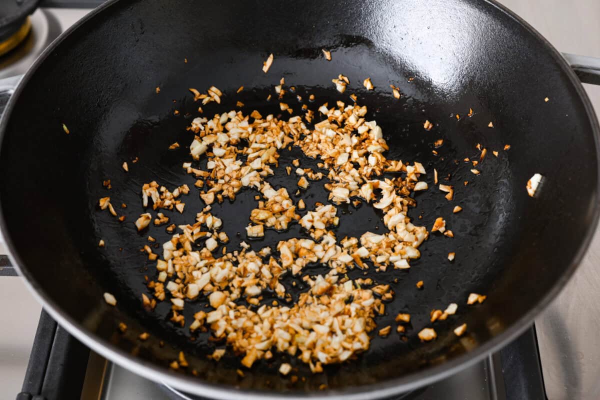 Garlic fried rice is one of the most common Filipino rice dishes. It combines leftover rice with crispy fried garlic, all tossed together with seasonings to create something simple that is incredibly flavorful! Angle shot of fried garlic, slightly brown.