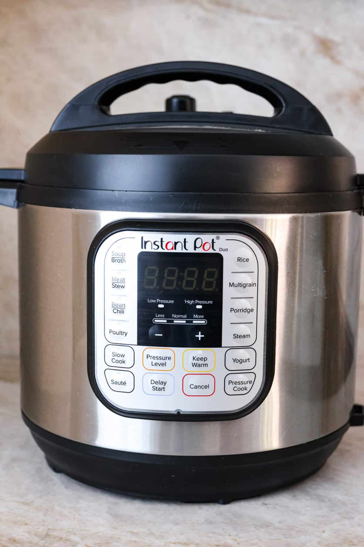 STOP being scared of your Instant Pot! This beginner's guide on How to Use an Instant Pot will help you feel comfortable and confident when using this magical kitchen appliance. It makes cooking fast, easy, and convenient. Close front view of the Instant pot.
