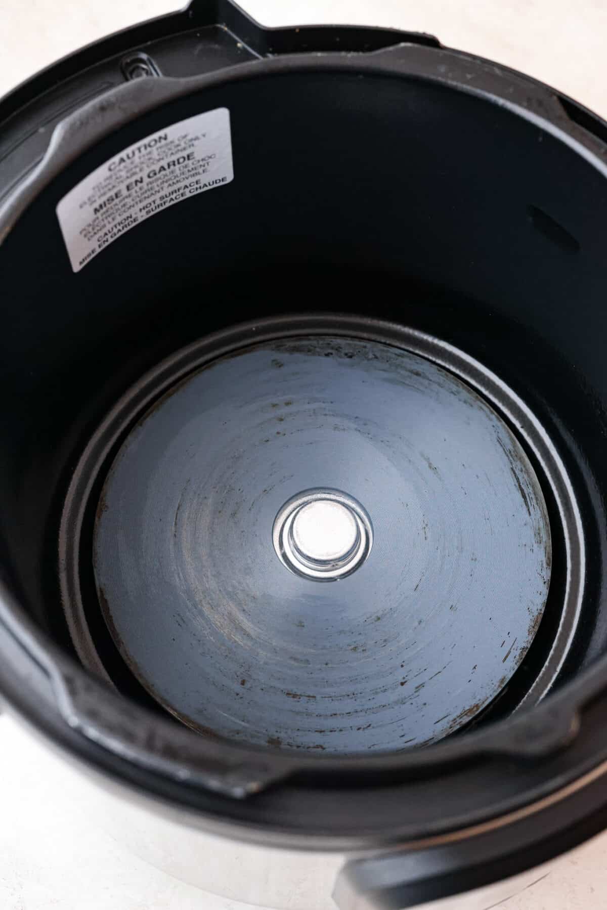 STOP being scared of your Instant Pot! This beginner's guide on How to Use an Instant Pot will help you feel comfortable and confident when using this magical kitchen appliance. It makes cooking fast, easy, and convenient. First photo of the instant pot base.