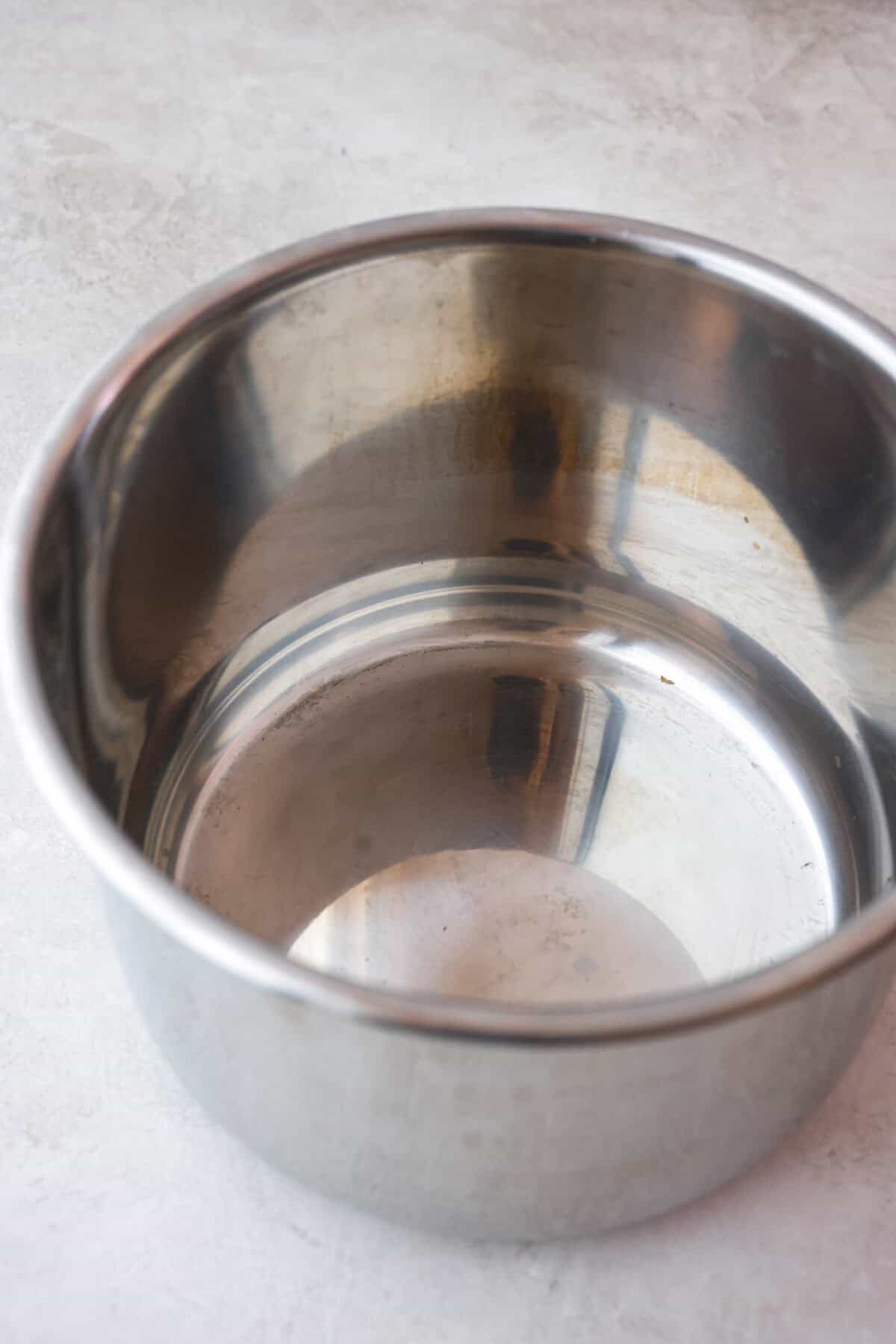 STOP being scared of your Instant Pot! This beginner's guide on How to Use an Instant Pot will help you feel comfortable and confident when using this magical kitchen appliance. It makes cooking fast, easy, and convenient. Second photo of the inner pot of the instant pot.
