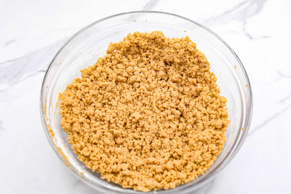 You will absolutely adore these Coffee Cake Cookies! They are loaded with that classic cinnamon sugar flavor, and the crumbly cinnamon streusel is to die for. It’s the perfect treat to enjoy at a special brunch, for the holidays, or a sweet treat for any night of the week. Overhead shot of wet and dry ingredients mixed together in a bowl.