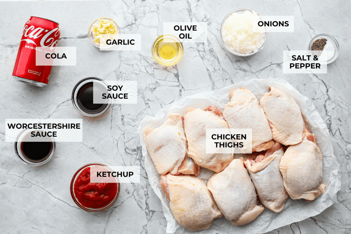 This incredibly tasty Coca-Cola chicken thigh recipe can be on the table in 40 minutes. The succulent sauce is a combination of savory soy sauce, Worcestershire, garlic, ketchup, and, of course, Coca-Cola. You've never had more flavorful chicken thighs than these! Overhead shot of labeled ingredients.