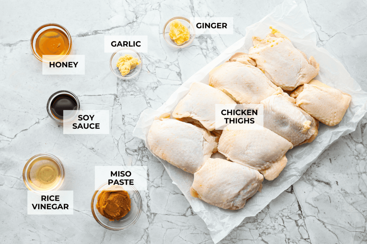 Miso chicken is super delicious and perfect for fans of bold Asian flavor. The skin crisps up, the meat stays juicy and tender, and the glaze caramelizes, creating a savory sauce perfect for drizzling over rice. Overhead shot of labeled ingredients.