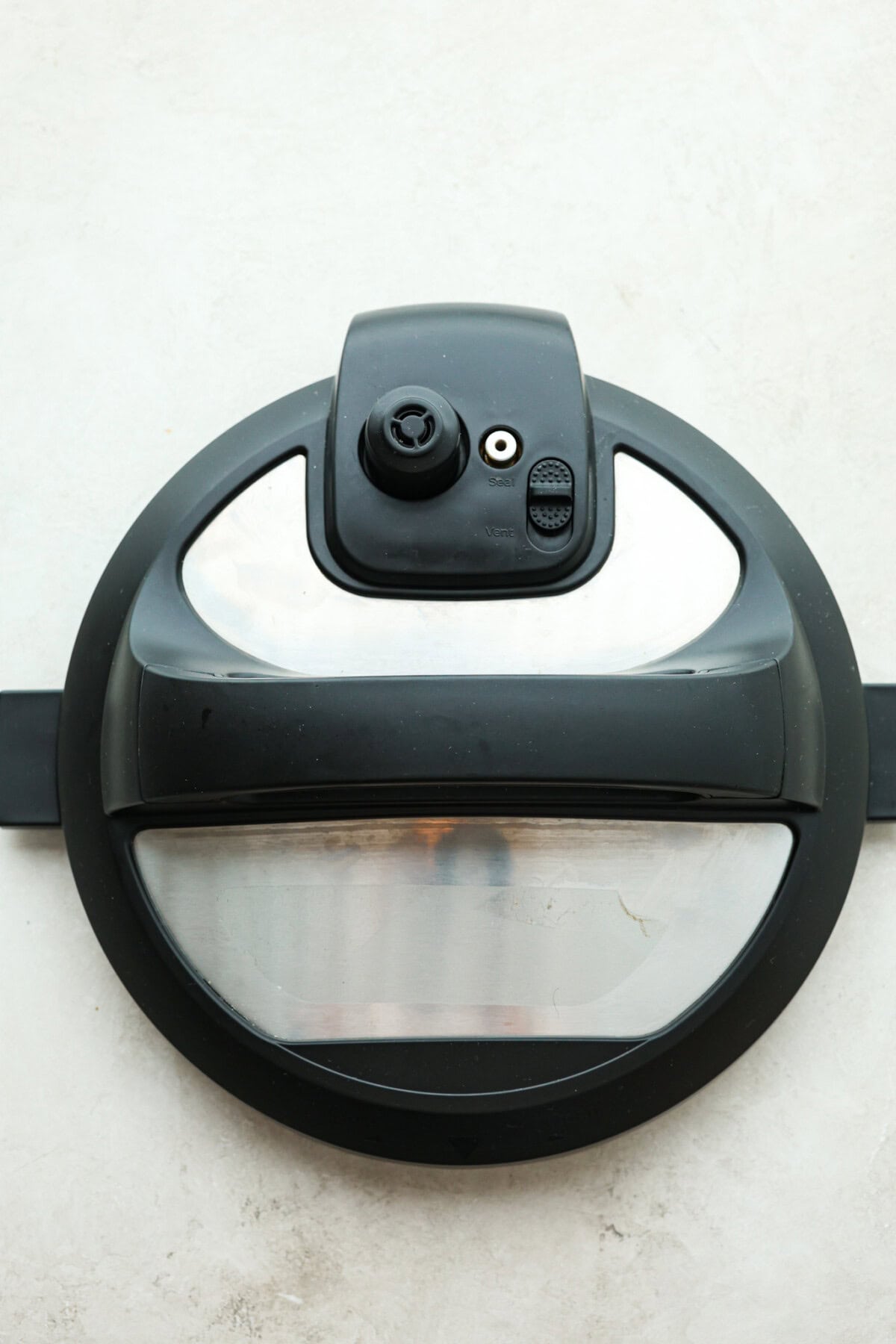 STOP being scared of your Instant Pot! This beginner's guide on How to Use an Instant Pot will help you feel comfortable and confident when using this magical kitchen appliance. It makes cooking fast, easy, and convenient. Third photo of the instant pot lid.