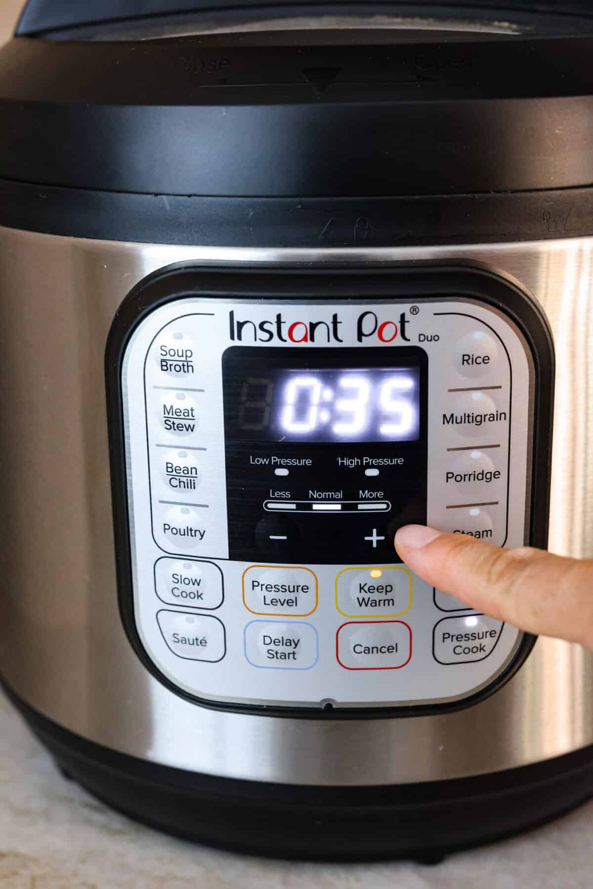 STOP being scared of your Instant Pot! This beginner's guide on How to Use an Instant Pot will help you feel comfortable and confident when using this magical kitchen appliance. It makes cooking fast, easy, and convenient. Second photo of the time adjusting on the Instant Pot control panel.