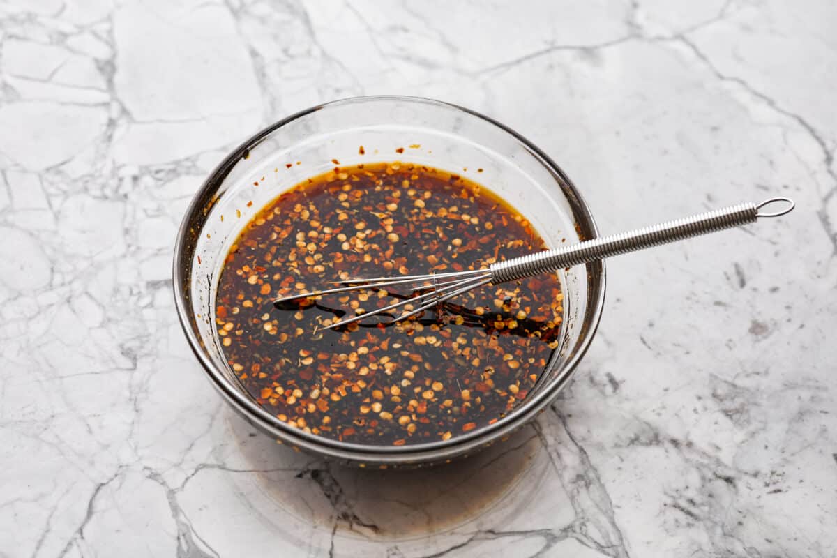 Mongolian Ground Beef and Noodles is a flavorful dinner that’s ready in 30 minutes! This dish combines tender noodles, savory ground beef, and a sweet and tangy Asian-inspired sauce for a meal that’s as comforting as it is delicious! Overhead shot of sauce ingredients mixed together in a bowl.