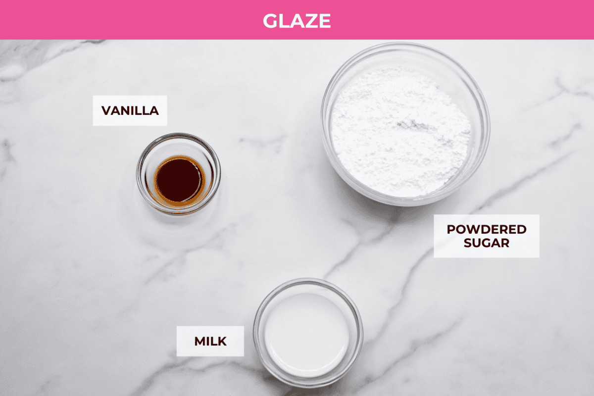 Biscuit Cinnamon Rolls are the most amazing twist on a classic! They are perfectly light, fluffy, and packed with cinnamon. The texture is more flakey and moist than traditional cinnamon rolls! Whether it’s for a cozy weekend breakfast or a holiday brunch, these hit the spot! Overhead shot of labeled glaze ingredients.