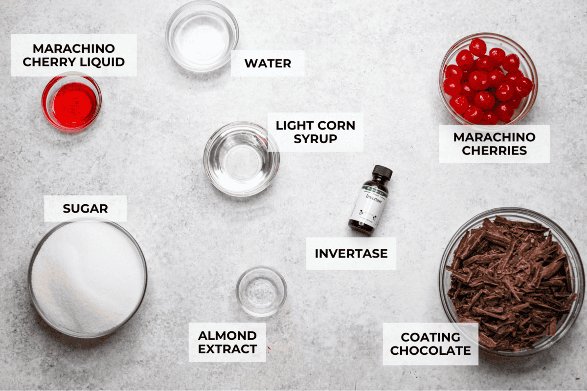 Homemade cherry cordials are a tasty, nostalgic treat! They're made with sweet cherries that are coated in a rich chocolate shell. Make them for Christmas or Valentineโs Day, and watch them disappear! Overhead shot of labeled ingredients.