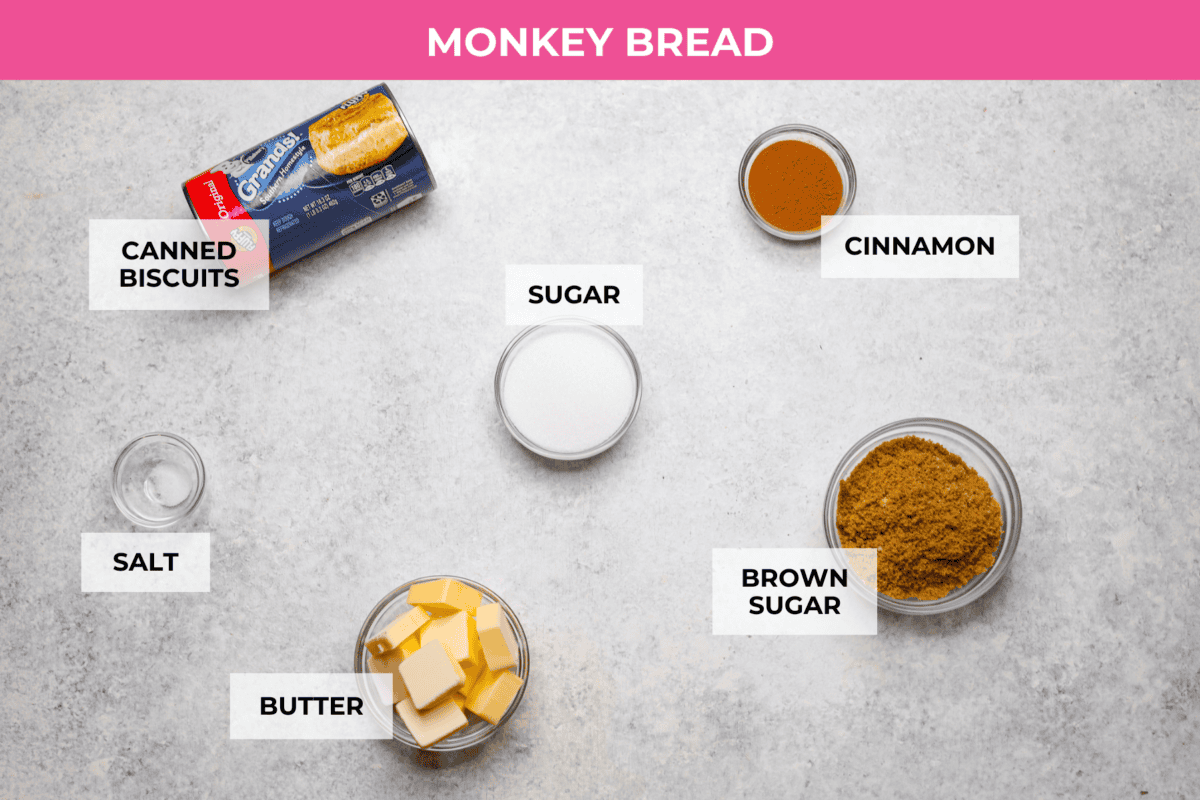 Crockpot monkey bread is an easy, gooey treat made in your slow cooker. It’s packed with soft biscuit pieces, cinnamon-sugar flavor, and a sweet buttery glaze. No oven needed! Overhead shot of labeled monkey bread ingredients.