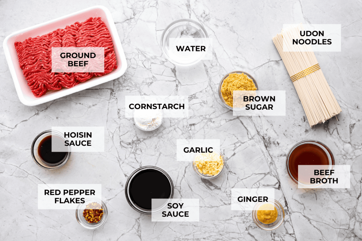 Mongolian Ground Beef and Noodles is a flavorful dinner that’s ready in 30 minutes! This dish combines tender noodles, savory ground beef, and a sweet and tangy Asian-inspired sauce for a meal that’s as comforting as it is delicious! Overhead shot of labeled ingredients.